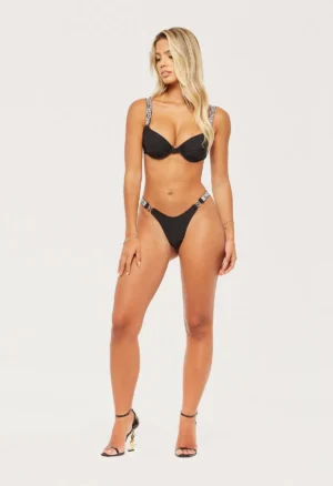 Woman in black rhinestone bikini set