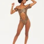 A woman in a leopard print bodysuit
